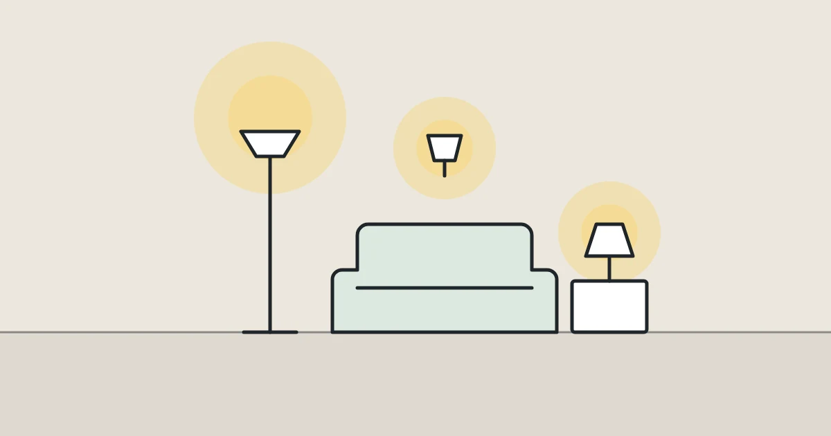Illustration of a living room lit by a floor lamp, a wall light and a table lamp